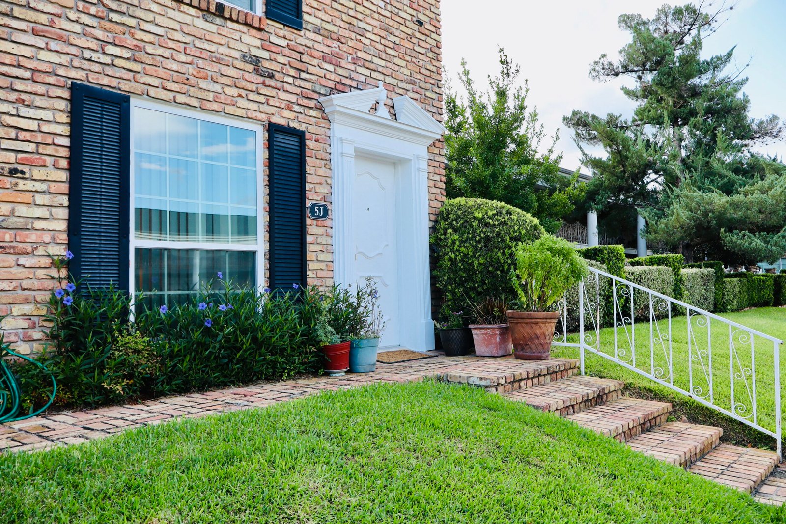 Old World Galleria Charm Ground level Courtyard Condo with dual entry accessibility and recently updated.
